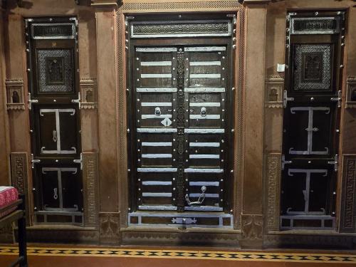 a pair of doors in a building at The Prince Haveli in Bikaner