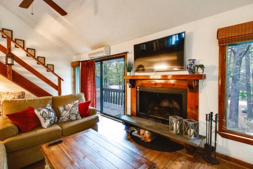 a living room with a couch and a fireplace at North Conway Condo Less Than 3 Mi to Slopes and Echo Lake in North Conway