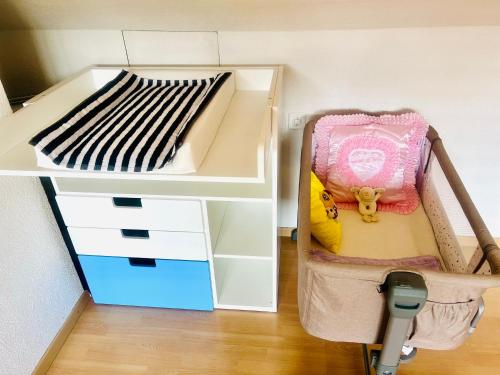 a white shelf with a bed in a room at Winner Star RVSVN Ferien Wohnung in Safenwil