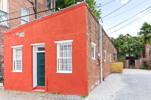 a red brick building with two windows and a door at 610 Franklin - 5B - 1 Bed, 1 Bath, Heart of Downtown, Washer & Dryer in Natchez