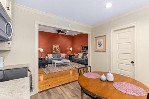 a living room with a table and a couch at 610 Franklin - 5B - 1 Bed, 1 Bath, Heart of Downtown, Washer & Dryer in Natchez