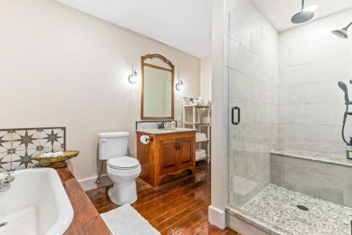 a bathroom with a tub and a toilet and a sink at 610 Franklin - Upstairs - 1 Bed, 1 Bath, Sleeps 4, Walk to Downtown in Natchez