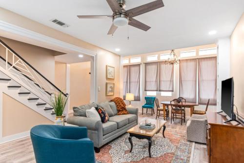 a living room with a couch and a tv at 610 Franklin - Downstairs - 2 Bed, 2 Bath, Heart of Downtown, Pet Friendly with fee in Natchez
