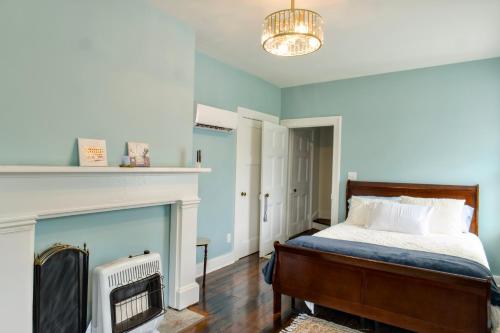 a bedroom with a bed and a fireplace at Borum House - 3 Bed, 2 & Half Bath, Full Kitchen, Heart of Downtown Natchez in Natchez