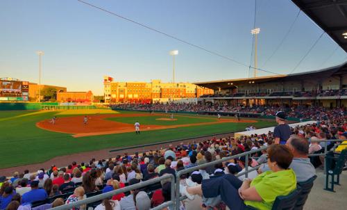 a crowd of people sitting in the stands at a baseball game at Staybridge Suites Bowling Green by IHG in Bowling Green