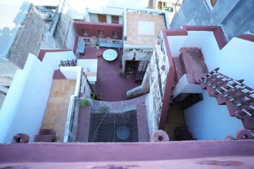 an overhead view of a building with stairs and buildings at The Prince Haveli in Bikaner