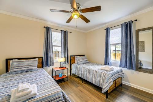 a bedroom with two beds and a ceiling fan at Updated New Bern Home Less Than 3 Mi to Historic Dtwn! in New Bern