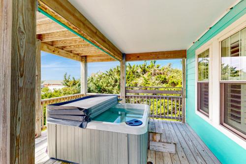 a hot tub on the deck of a house at Days to Remember in Avon