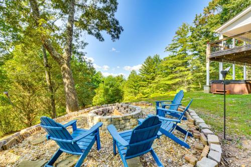 a group of blue chairs sitting around a fire pit at Hiawassee Hideaway Hot Tub, Lake and Mountain Views in Hiawassee