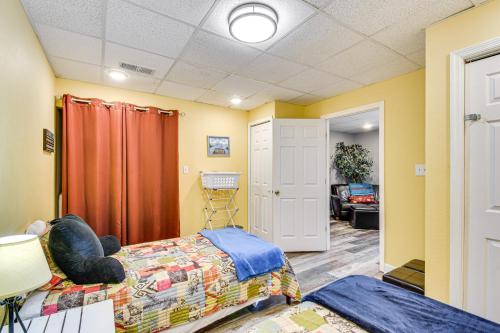a bedroom with a bed and a living room at Hiawassee Hideaway Hot Tub, Lake and Mountain Views in Hiawassee