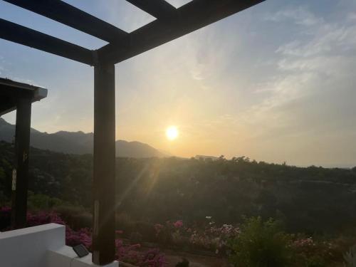a view of the sunset from the porch of a house at Sunset View Penthouse Apartment 2 Bedrooms Tatlisu in Akanthou