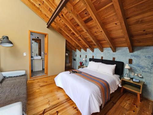 Postel nebo postele na pokoji v ubytování Hotel Jardines Del Carmen