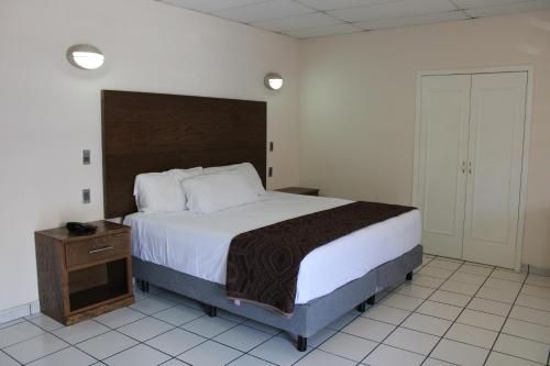 Postel nebo postele na pokoji v ubytování Hotel Sntenario