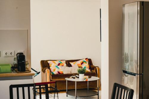 a living room with a couch and a table at Casa da Vira - Alojamento Local in Arcos de Valdevez
