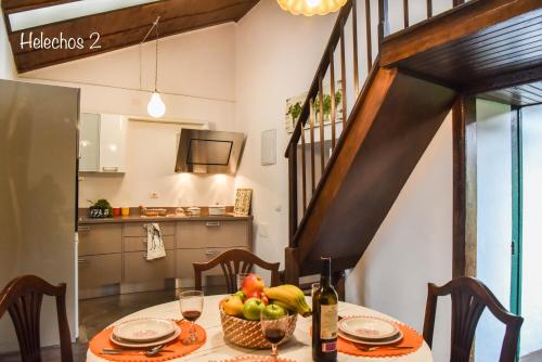 a dining room with a table with a bowl of fruit at Emblemática Los Helechos in Los Realejos