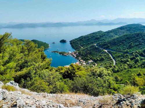 a view of a lake from a hill at LILY's Peaceful Oasis- BRAND NEW in Korita