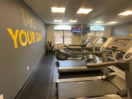 a gym with several treadmills in a room at Comfort Inn & Suites Virginia Beach - Norfolk Airport in Virginia Beach