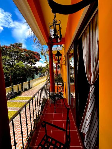 a balcony with a table and chairs on it at Hotel Jotam in Panajachel