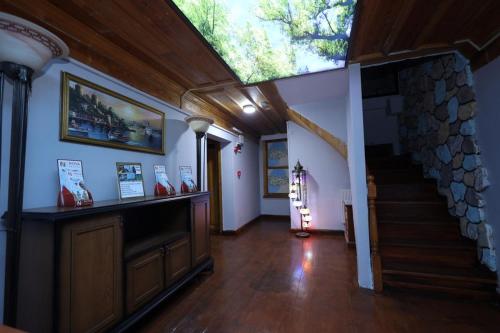 a living room with a skylight and a staircase in a house at The Trip istanbul Hotel in Istanbul