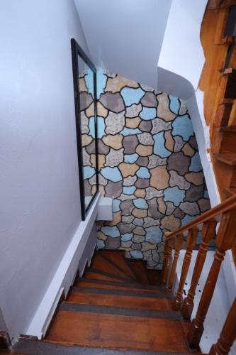 a stairway with a stone wall and a stair case at The Trip istanbul Hotel in Istanbul