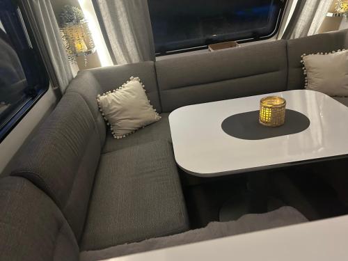 a small table in the back of a vehicle at Weberhof-Münster Glamping in Münster