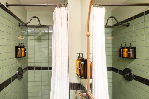 a bathroom with a shower with a fire hydrant in it at The Constance by The Lenox Collection in Lenox