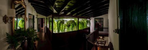 a hallway of a house with a door with a window at Emblemática Los Helechos in Los Realejos