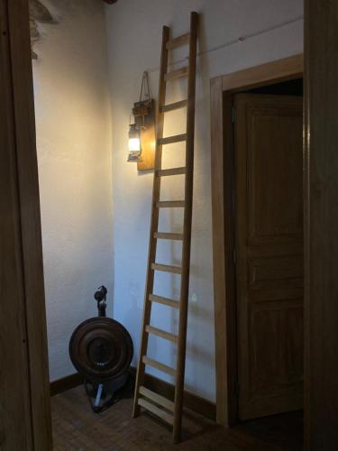 a bathroom with a ladder and a toilet in a room at Helikon -la dimora del viandante- in Montalbano Elicona
