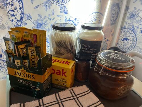 a counter with some food and jars of condiments at Seaside Getaway @ Swallow House Suite #2 in Cape Town