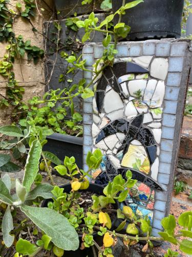 a stained glass window in a garden at Seaside Getaway @ Swallow House Suite #2 in Cape Town