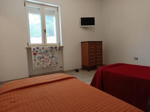 Postel nebo postele na pokoji v ubytování Casa vacanza Il Rifugio