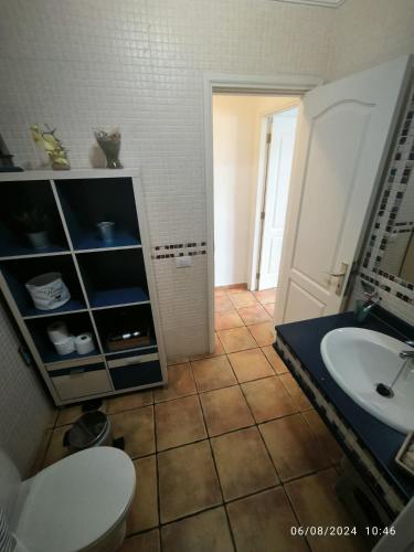 a bathroom with a toilet and a sink at Casa Frasca in Teguise