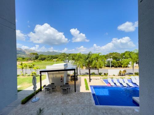 a view of a swimming pool and a house at Sanctuary by Playa Caracol Residences in Punta Chame