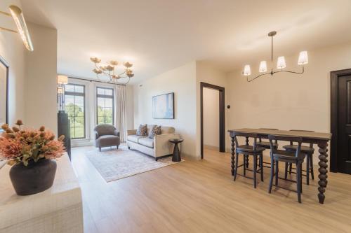 a living room with a table and a couch at The Penrose Suites in Saint Marys