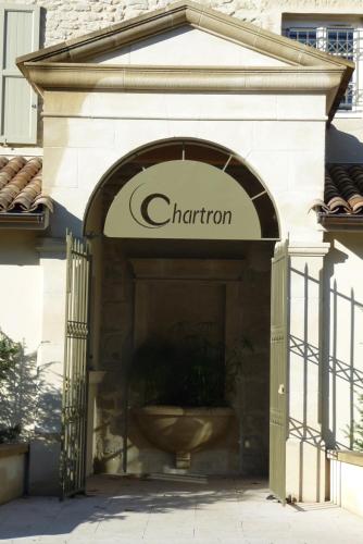 an entrance to a store with a sign that reads charron at Hotel Restaurant Chartron in Saint-Donat-sur-lʼHerbasse