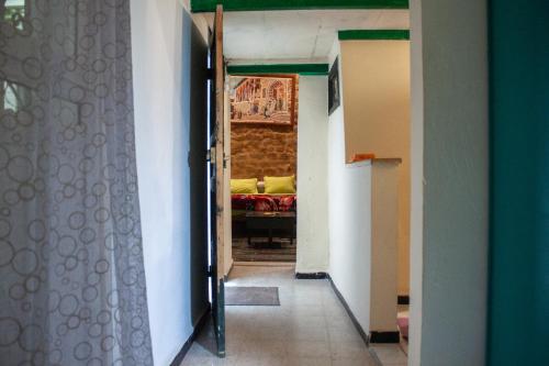a hallway with a room with a bed in it at Dar kenza Tunis in Tunis