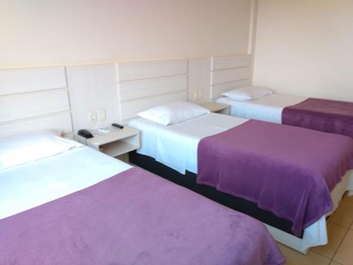 Ένα ή περισσότερα κρεβάτια σε δωμάτιο στο Thile Park Hotel