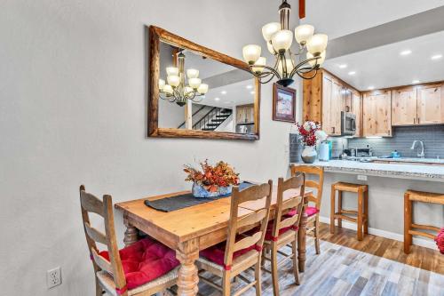a kitchen and dining room with a wooden table and chairs at Carnelian Bay 2BR + Loft Near Beach & Trails in Carnelian Bay