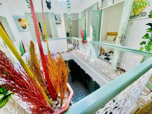 a room with a staircase with potted plants at Riad Dar Lokman in Marrakech