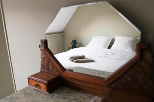 Una cama o camas en una habitación de La Part Entière