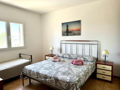 Posteľ alebo postele v izbe v ubytovaní Villa Fiorella Porto Cesareo primo piano 2 locali