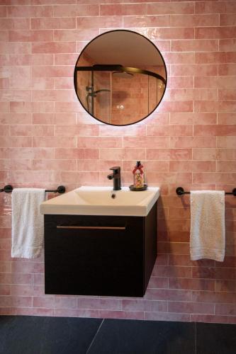 a bathroom with a sink and a mirror at Rowing club house in Carrick on Shannon