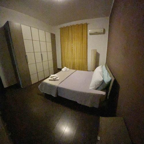 a bedroom with a bed with towels on it at B&b L’Attico e la Ballata in Brusciano