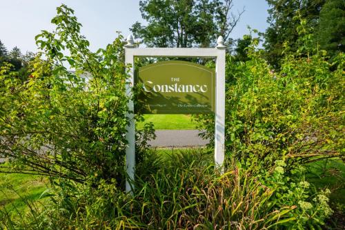 a sign for the entrance to a garden at The Constance by The Lenox Collection in Lenox
