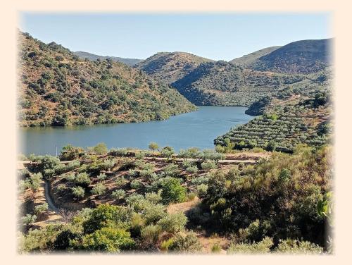 an aerial view of a lake in the mountains at Casa do Rossio in Fornos