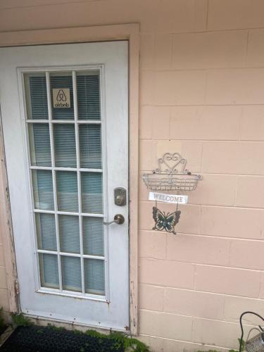 a door to a house with a butterfly on it at Botanical Tranquility in Orlando