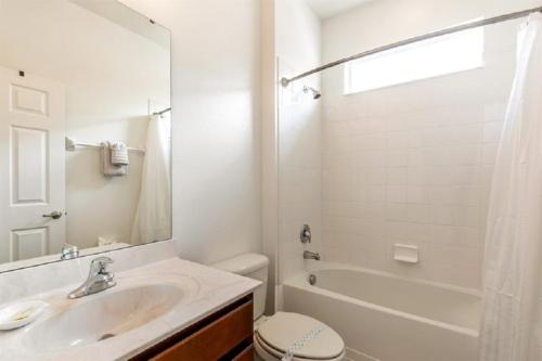 a bathroom with a sink and a tub and a toilet at 494 - Fabulous 5 Bed Villa with South West Facing pool and Spa Overlooking Water and Conservation in Loughman
