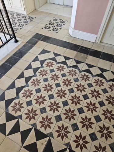 a tiled floor in a room with a tile floor at כוהנ'ס Cohen's Boutique Hotel in Haifa