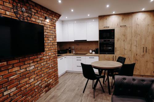 Kuchyň nebo kuchyňský kout v ubytování Apartamenty Chrobrego 10