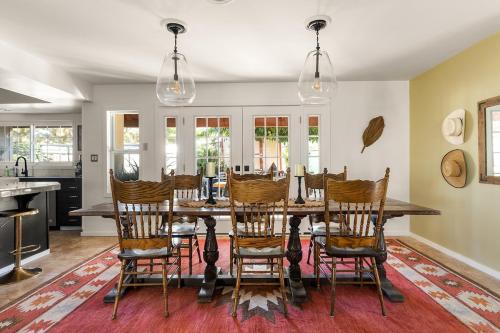 a dining room with a table and chairs at Ember Stone in Yucca Valley